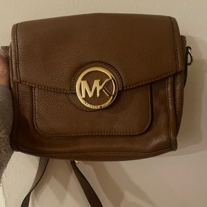 Michael Kors cross body brown leather purse.